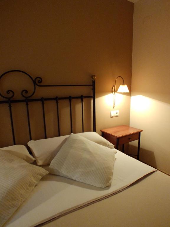 Postel nebo postele na pokoji v ubytování Hotel Areulo