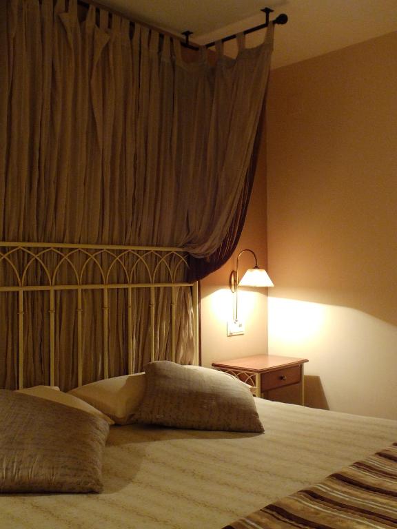 Postel nebo postele na pokoji v ubytování Hotel Areulo