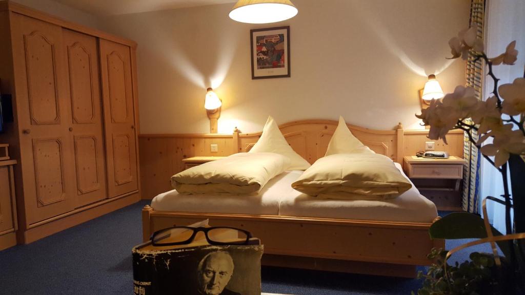 Postel nebo postele na pokoji v ubytování Hotel Camona & Apart Walserhof