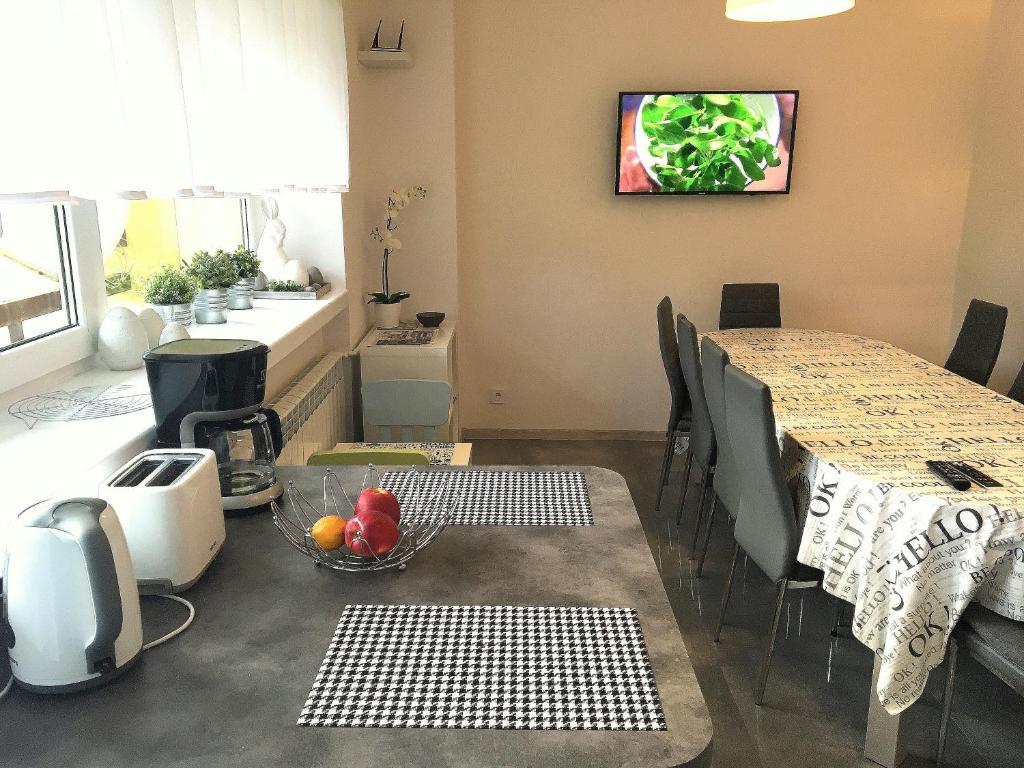 Televízia a/alebo spoločenská miestnosť v ubytovaní Apartament Melisa