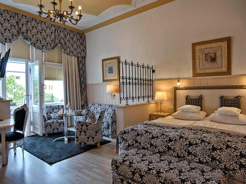 Postel nebo postele na pokoji v ubytování Hotel Augusta Am Kurfürstendamm