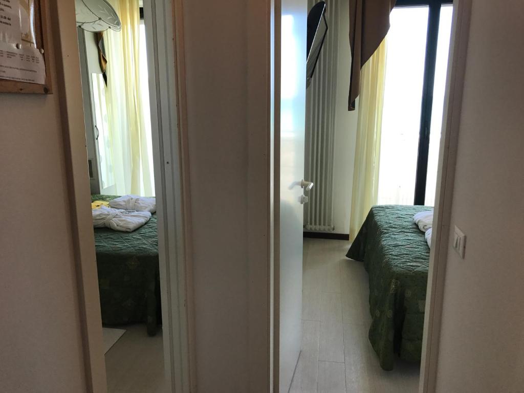 Postel nebo postele na pokoji v ubytování Hotel Byron