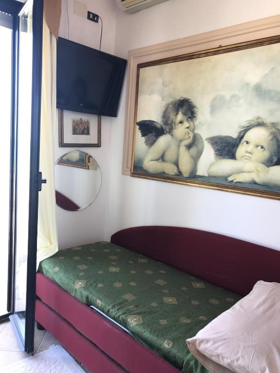 Postel nebo postele na pokoji v ubytování Hotel Byron
