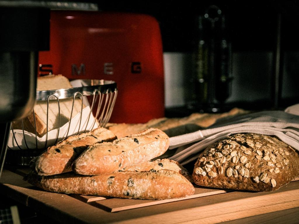 a bunch of loaves of bread on a table at Best Western Plus Antibes Riviera in Antibes
