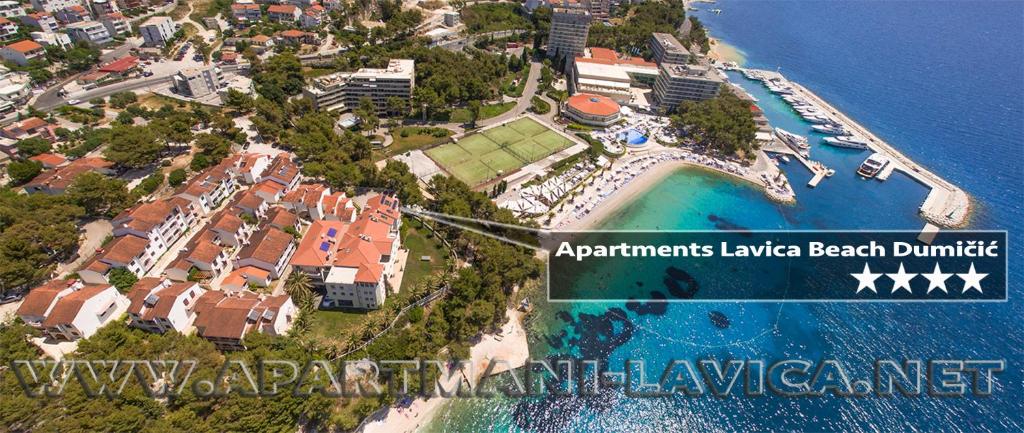 an aerial view of a resort near the ocean at Apartments Lavica Beach Dumičić in Podstrana