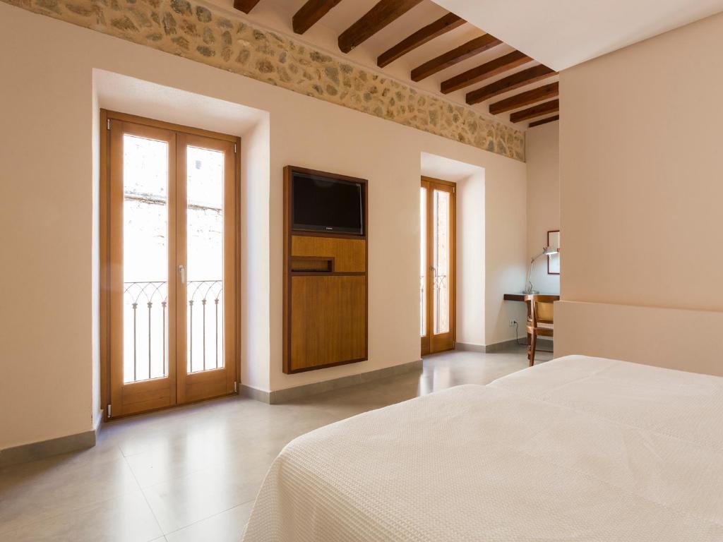 Postel nebo postele na pokoji v ubytování Ca' n Beia Suites - Adults Only
