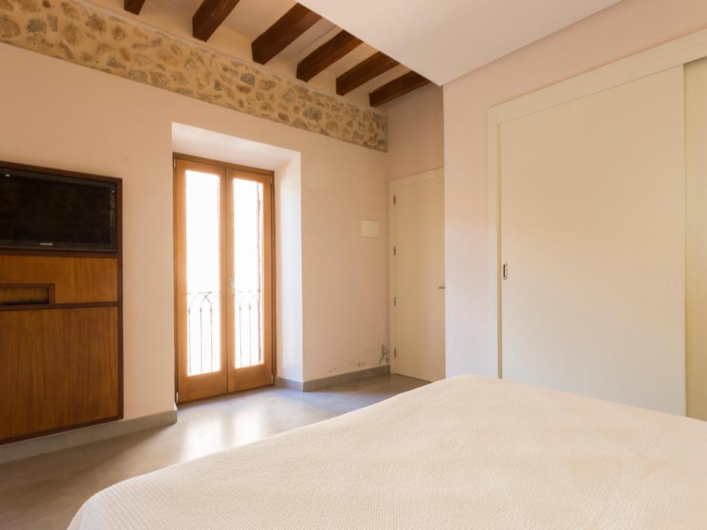 Postel nebo postele na pokoji v ubytování Ca' n Beia Suites - Adults Only