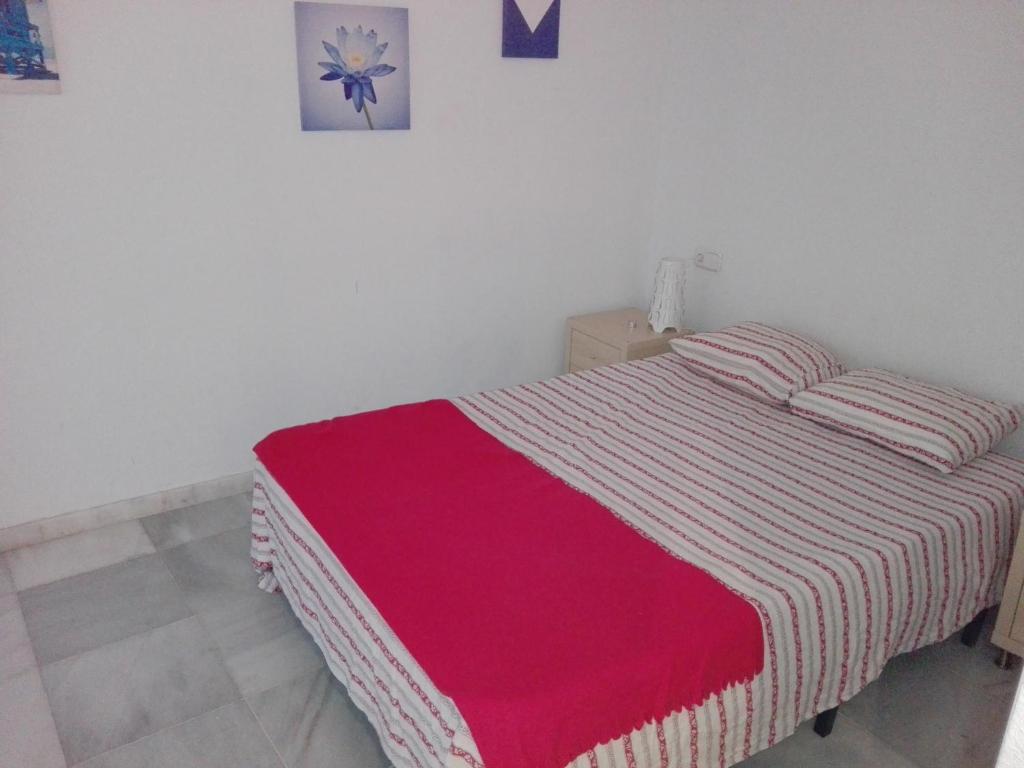 Łóżko lub łóżka w pokoju w obiekcie Céntrico Apartamento con Patio Privado