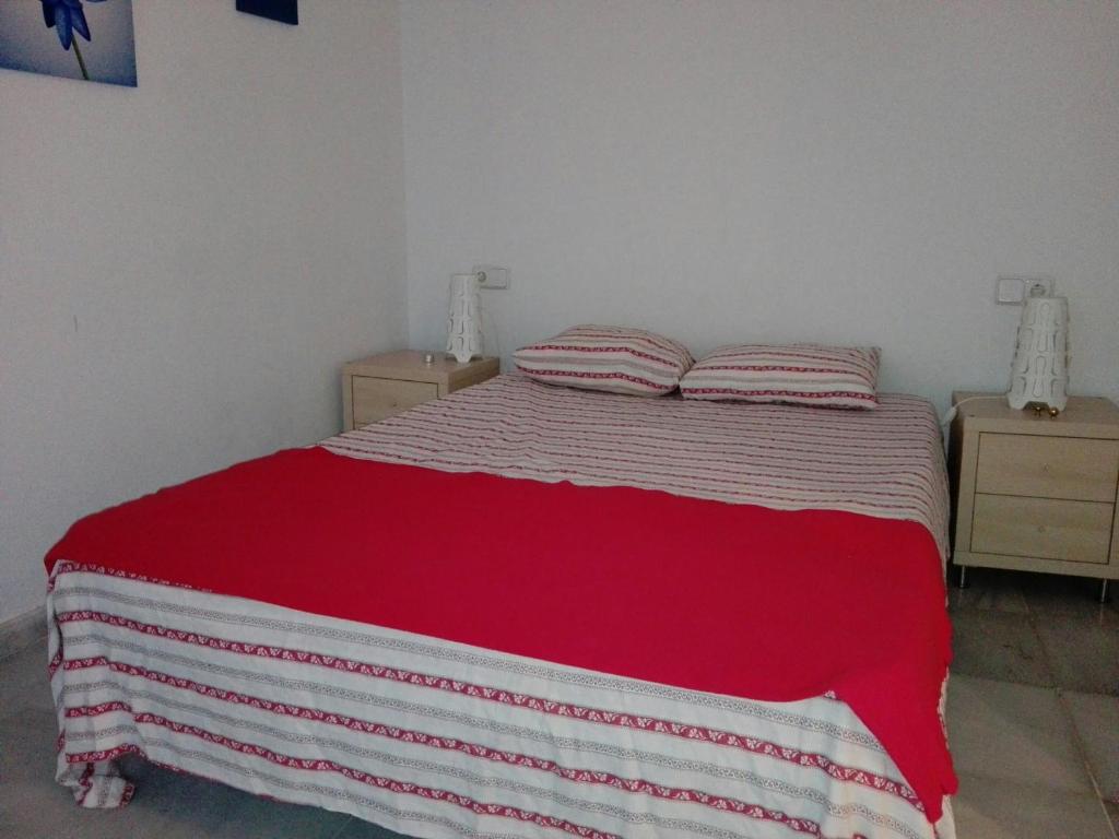 Łóżko lub łóżka w pokoju w obiekcie Céntrico Apartamento con Patio Privado
