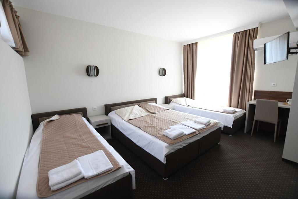 Postel nebo postele na pokoji v ubytování Atrijum Apartments and Rooms