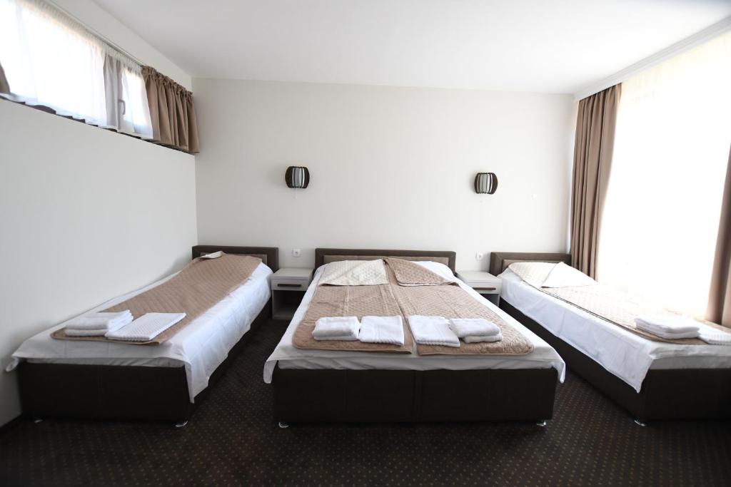 Postel nebo postele na pokoji v ubytování Atrijum Apartments and Rooms