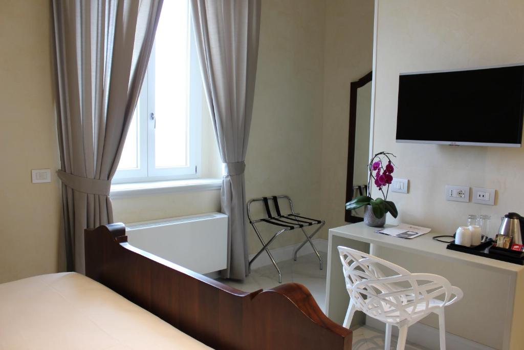 Postel nebo postele na pokoji v ubytování Hotel Altavilla Catanzaro