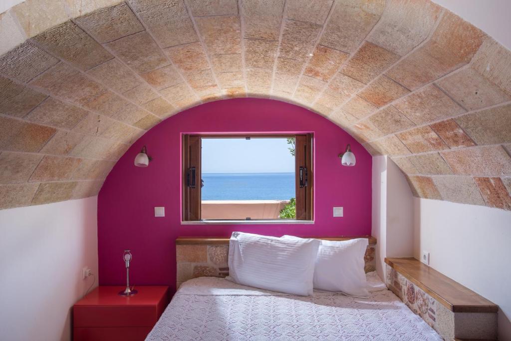 Postel nebo postele na pokoji v ubytování Aktaion Hotel