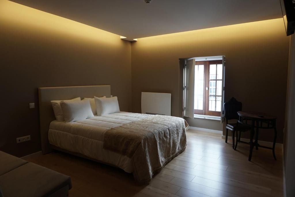Postel nebo postele na pokoji v ubytování Feira Hostel & Suites