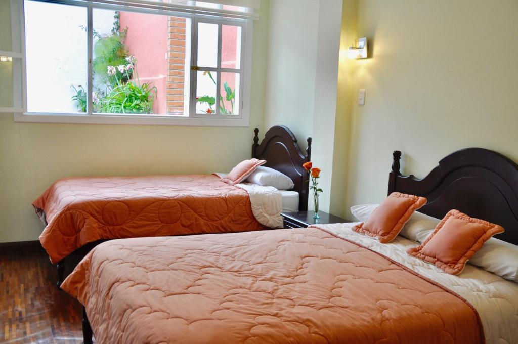 Postel nebo postele na pokoji v ubytování Hotel Europa