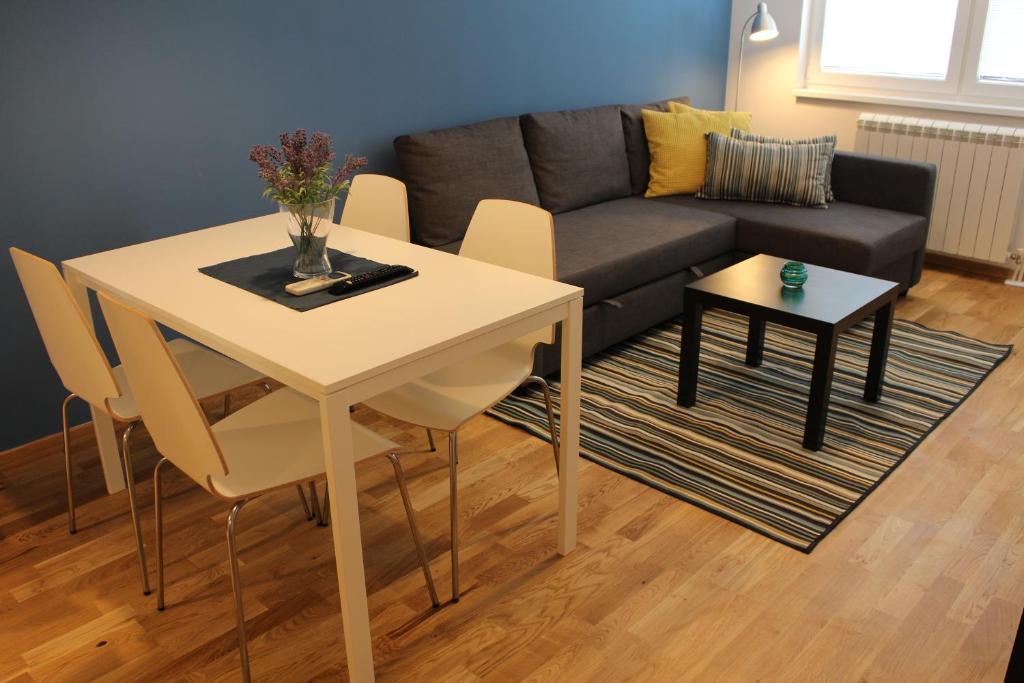 a living room with a table and a couch at Skopje home 2 in Skopje