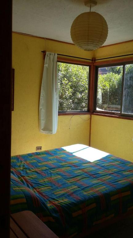 Postel nebo postele na pokoji v ubytování Cabaña Los Laureles