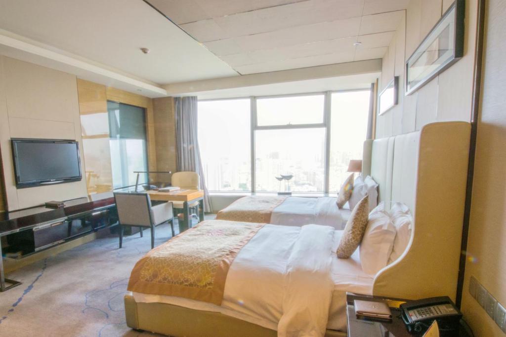 TV a/nebo společenská místnost v ubytování Tangla Hotel Tianjin