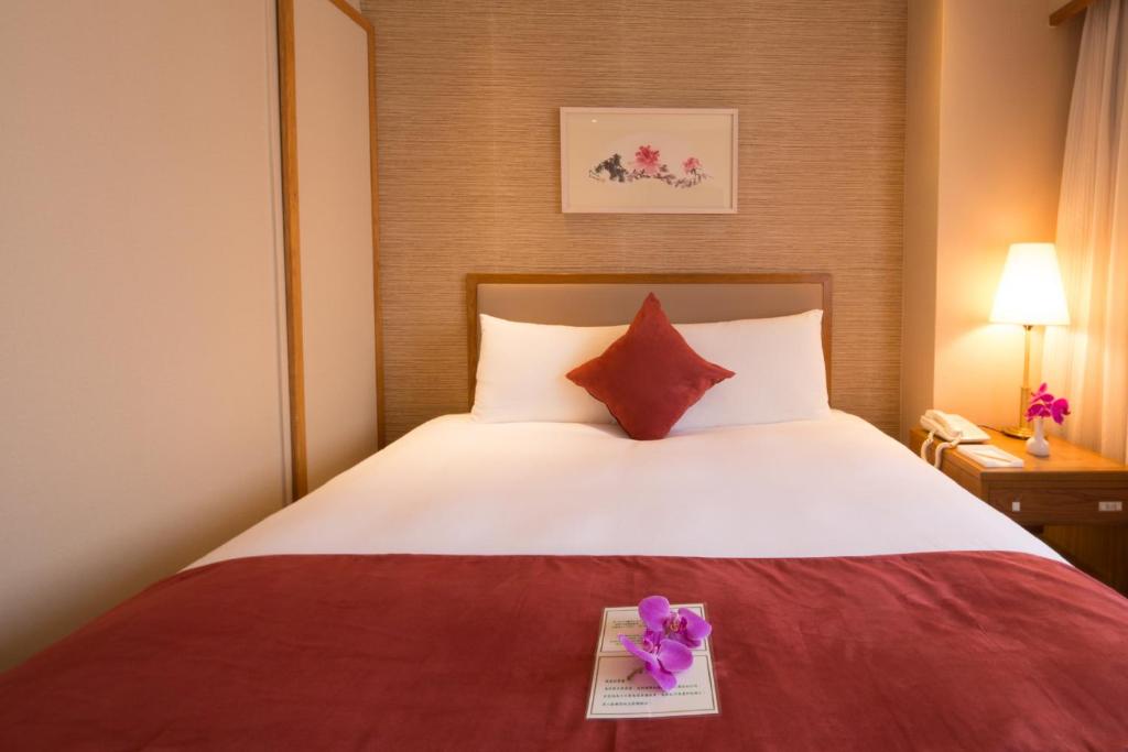 Postel nebo postele na pokoji v ubytování Hotel Riverview Taipei