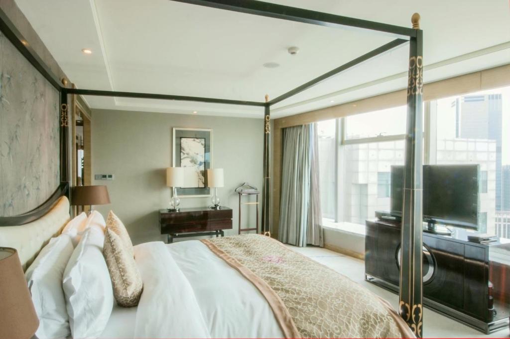 TV a/nebo společenská místnost v ubytování Tangla Hotel Tianjin