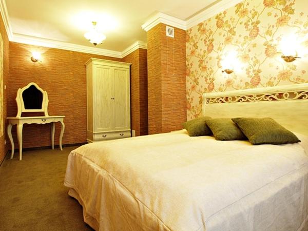 Postel nebo postele na pokoji v ubytování Hotel Fajkier