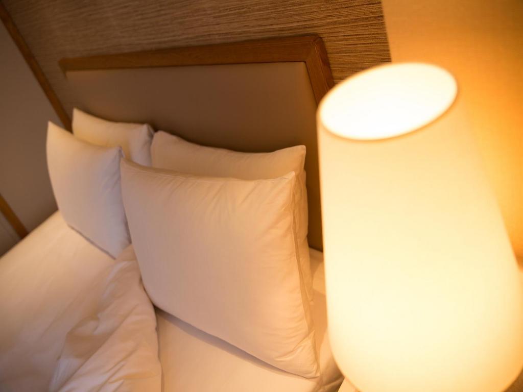 Postel nebo postele na pokoji v ubytování Hotel Riverview Taipei