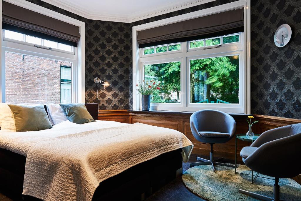 Postel nebo postele na pokoji v ubytování Guesthouse Villa Emmen