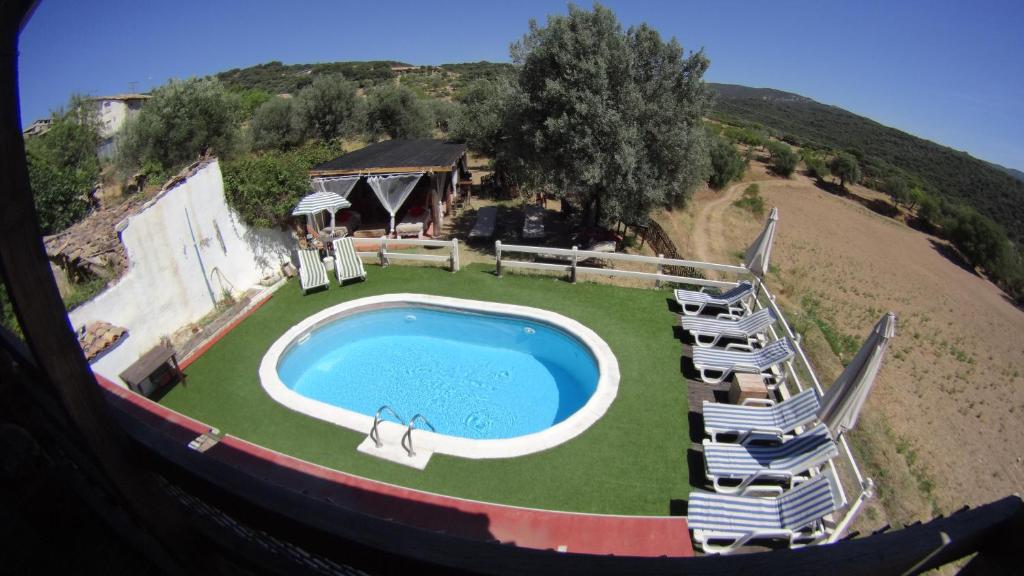 an aerial view of a swimming pool with chairs around it at Casa Maza in Asque
