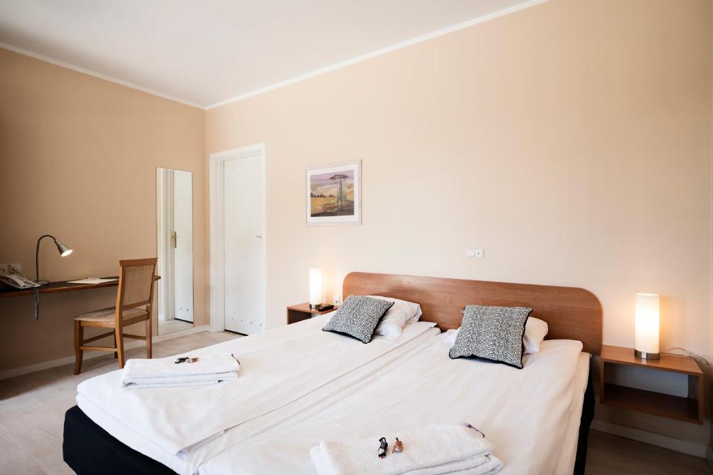 Letto o letti in una camera di Hotel Sleep2Night