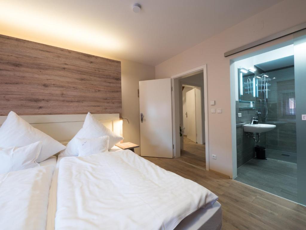 Postel nebo postele na pokoji v ubytování Hotel - Weinbar FAHR AWAY
