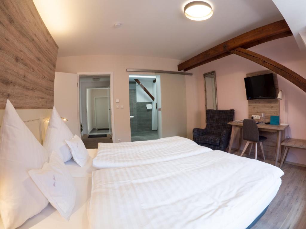 Postel nebo postele na pokoji v ubytování Hotel - Weinbar FAHR AWAY