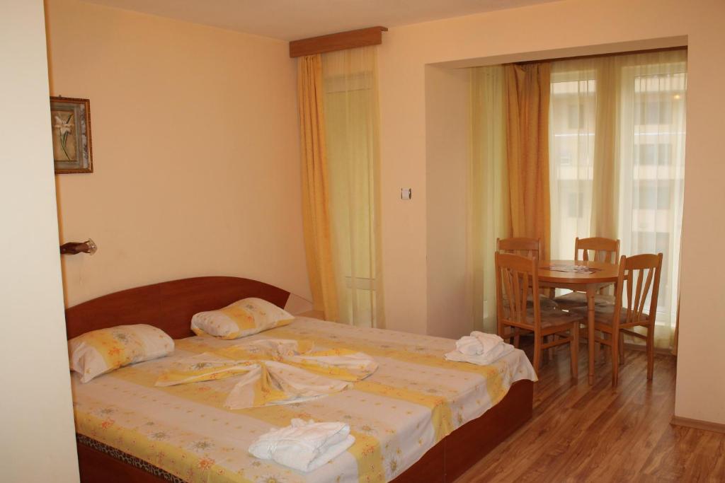 Postel nebo postele na pokoji v ubytování Apart Hotel Hetodon