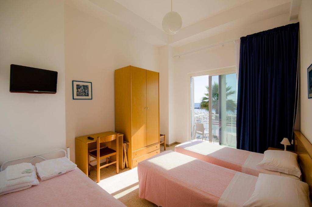 Säng eller sängar i ett rum på Hotel Ideal