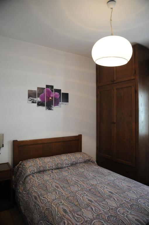 Postel nebo postele na pokoji v ubytování Hotel Eternità