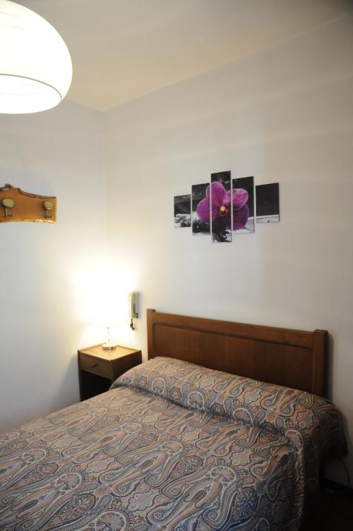 Postel nebo postele na pokoji v ubytování Hotel Eternità