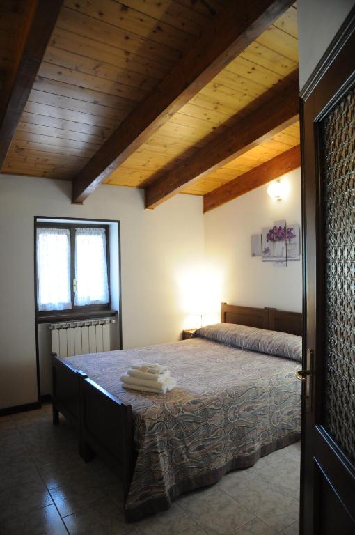 Postel nebo postele na pokoji v ubytování Hotel Eternità