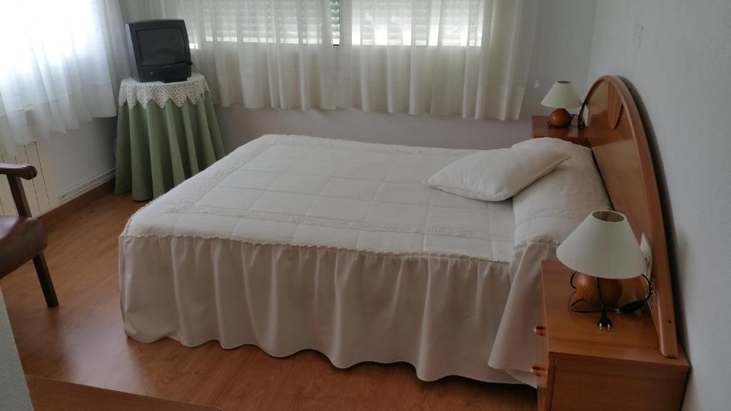 Postel nebo postele na pokoji v ubytování Hotel A Roda