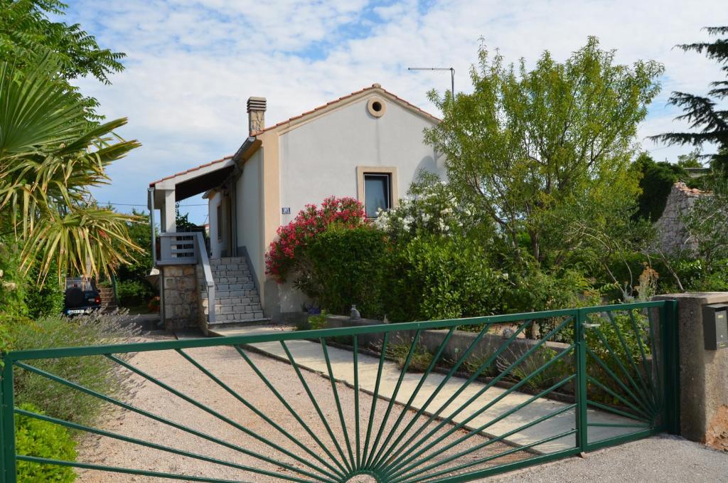 a house with a gate in front of it at Haus Knott in Polje