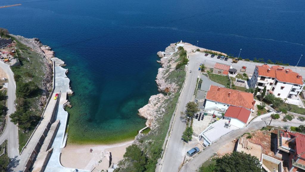 an aerial view of a city and the ocean at Apartments Danica in Vrbnik