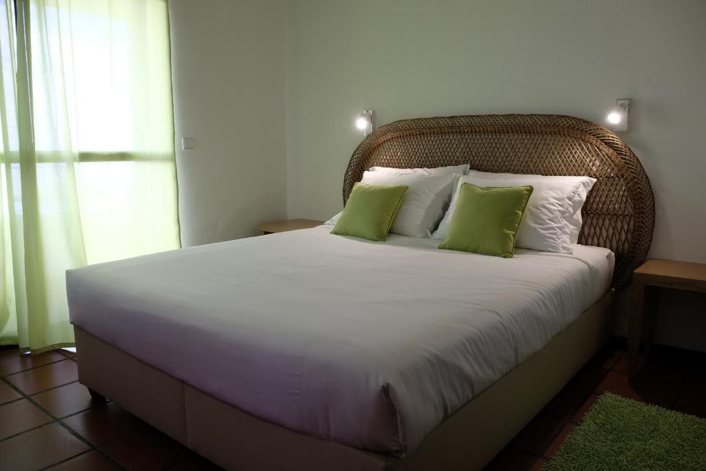 Postel nebo postele na pokoji v ubytování Apartamentos Quinta Mae dos Homens