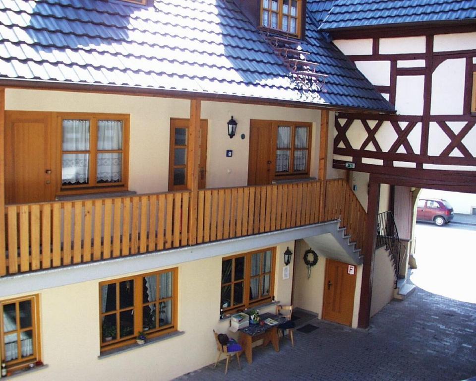 an overhead view of a house with a wooden balcony at Gästehaus am Westtor in Prichsenstadt