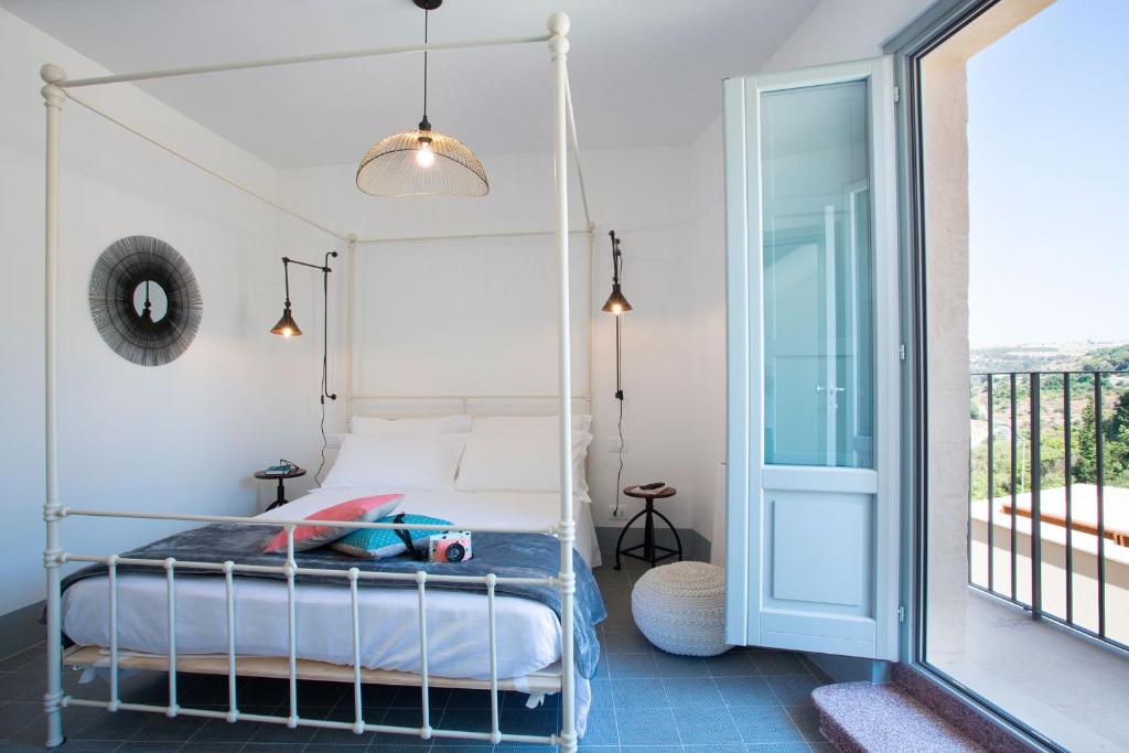 Postel nebo postele na pokoji v ubytování Intervallo Boutique Hotel