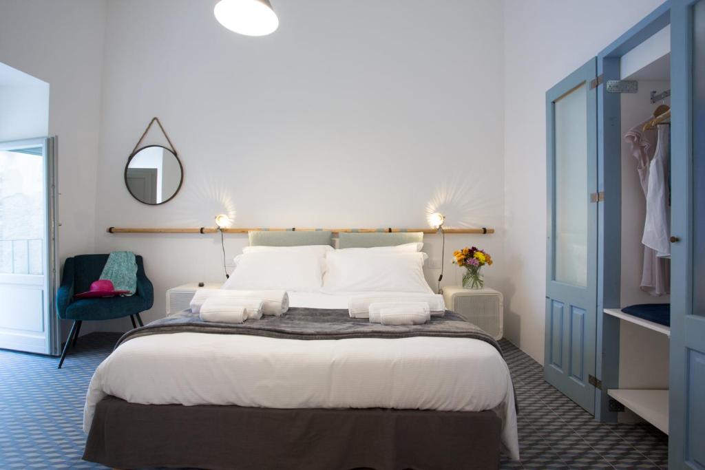 Postel nebo postele na pokoji v ubytování Intervallo Boutique Hotel