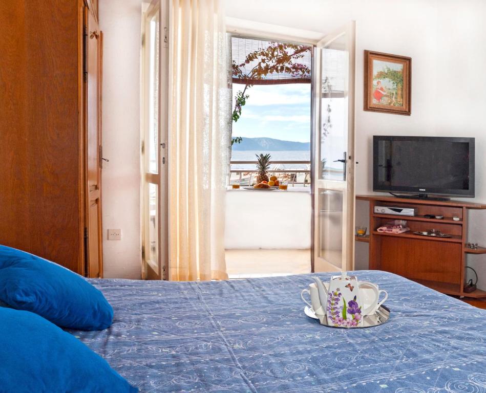 Postel nebo postele na pokoji v ubytování Apartmani Ines