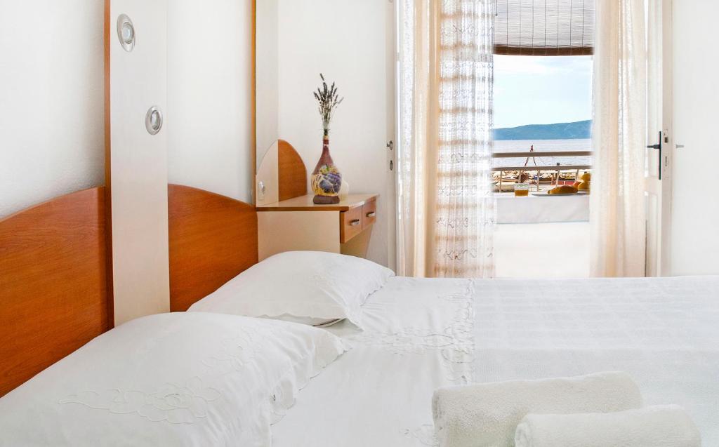 Postel nebo postele na pokoji v ubytování Apartmani Ines