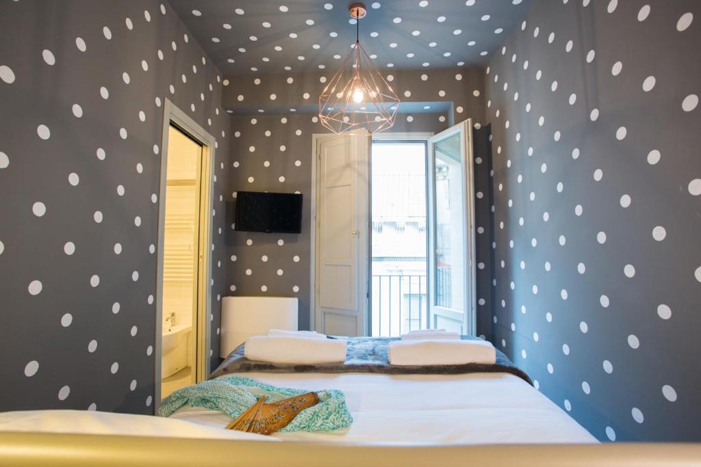 Postel nebo postele na pokoji v ubytování Intervallo Boutique Hotel