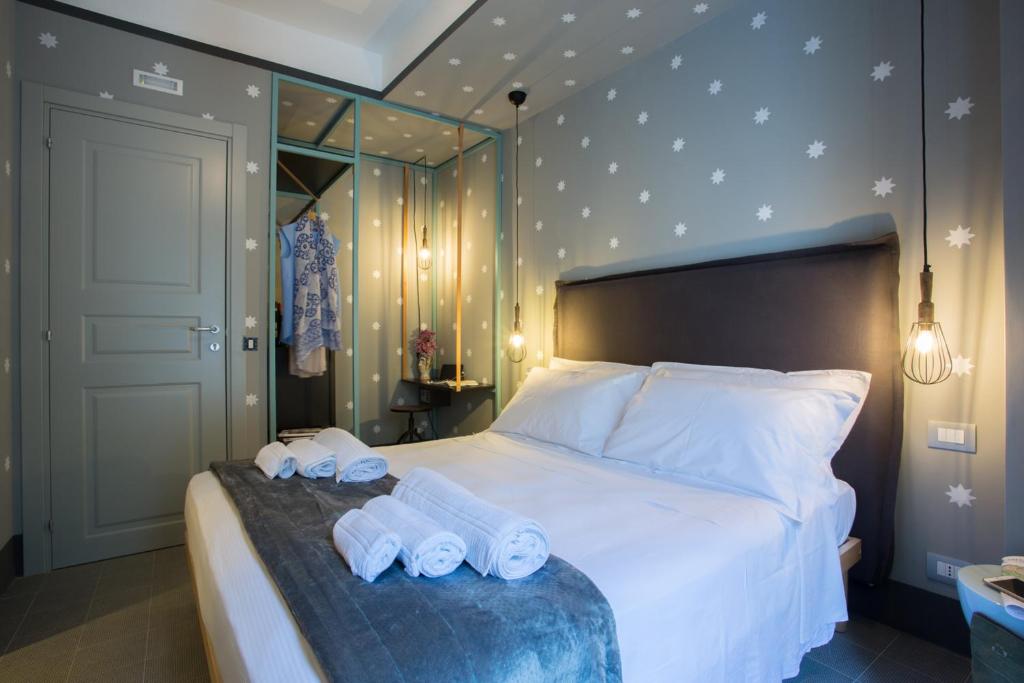 Postel nebo postele na pokoji v ubytování Intervallo Boutique Hotel
