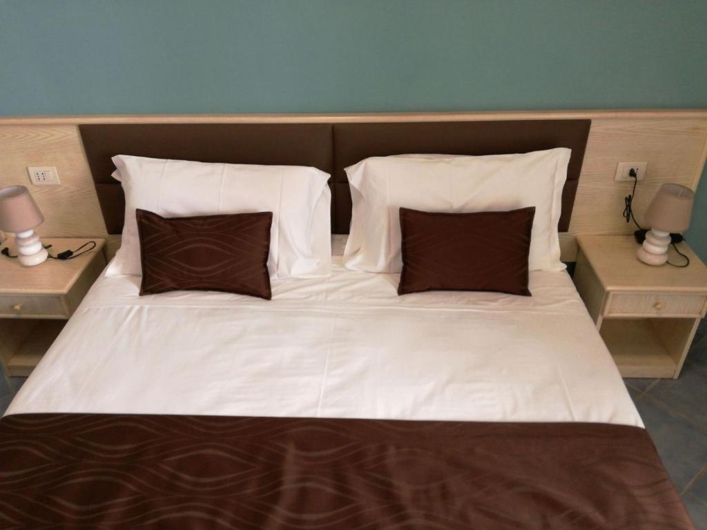 Кровать или кровати в номере Hotel Soleluna