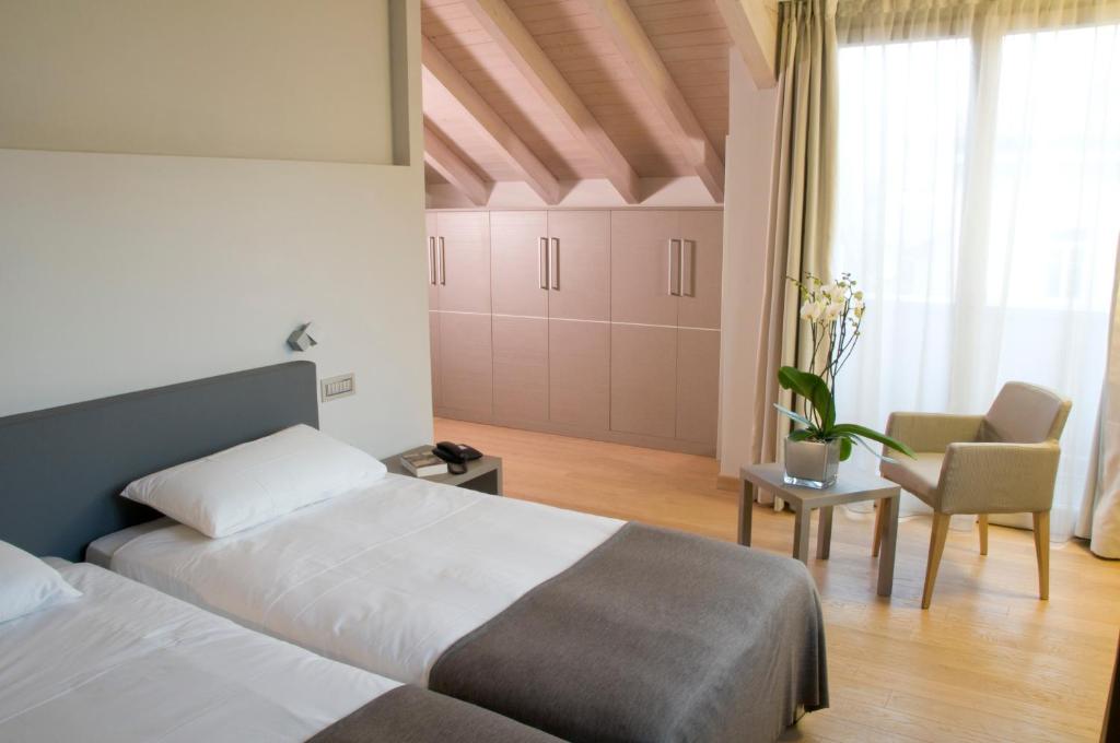 Postel nebo postele na pokoji v ubytování Hotel Di Varese
