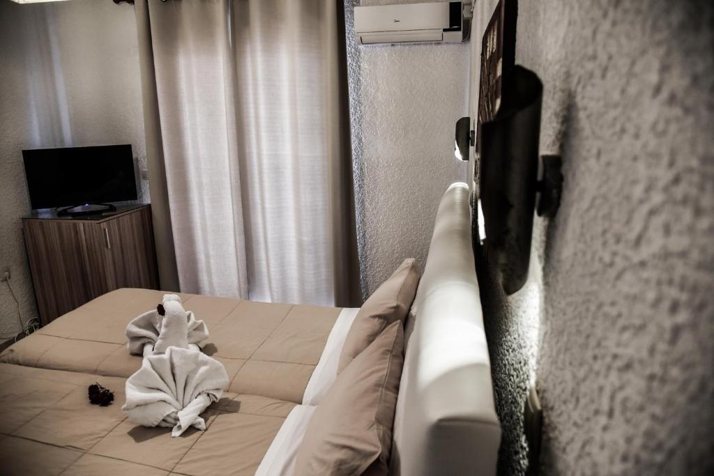 TV a/nebo společenská místnost v ubytování Vallian Village Hotel